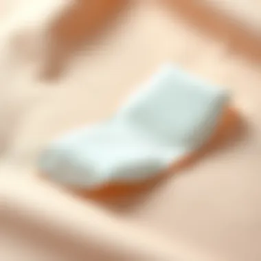 Stylish adhesive bra pad showcased on a soft fabric background