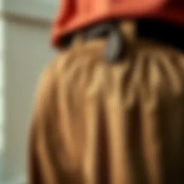 Close-up of fabric texture showcasing the quality of belted paperbag pants.