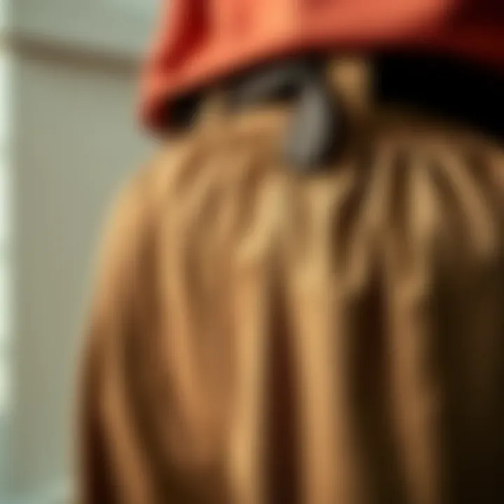 Close-up of fabric texture showcasing the quality of belted paperbag pants.