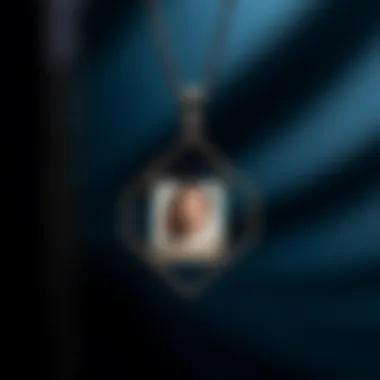 A modern geometric pendant necklace displaying a colorful miniature picture