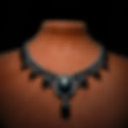 An elegant black gemstone necklace displayed on a velvet background, highlighting its intricate design and shine.