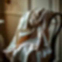 An elegant sparkly scarf draped over a vintage chair, showcasing its texture and shimmer.