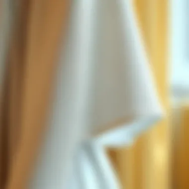 Close-up of intricate fabric details on a cape sleeve design