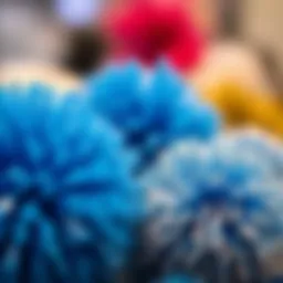 A close-up view of blue and silver pom poms used in fashion accessories