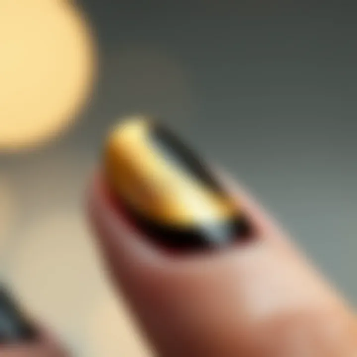 Close-up of a gold moon nail decal applied on a nail