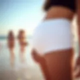 Stylish high-waisted maternity swim bottoms showcased on a beach