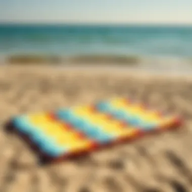 Vibrant inflatable beach mat on sandy shore