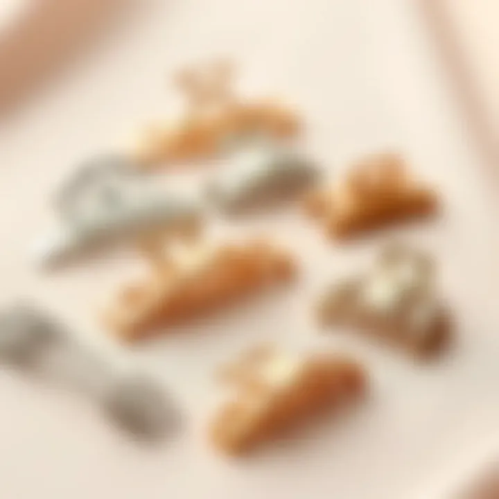 Artistic Arrangement of Metal Claw Hair Clips A variety of metal claw hair clips arranged artistically on a soft fabric background.