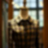 Elegant button front tweed dress showcased on a mannequin