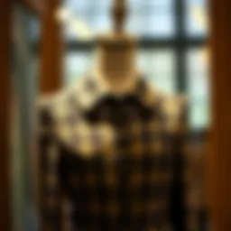 Elegant button front tweed dress showcased on a mannequin